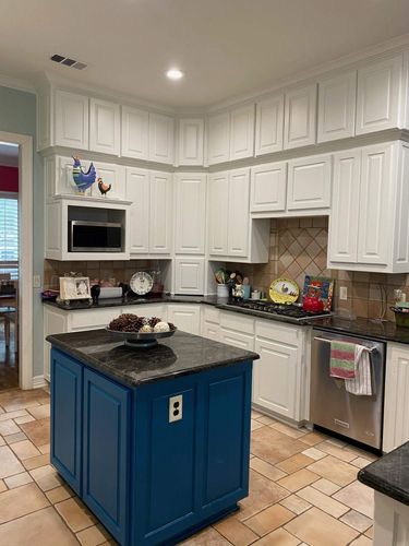 A kitchen whose cabinets were painted by Spray Tex.