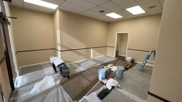 Beginning to prep the inside of an office for painting